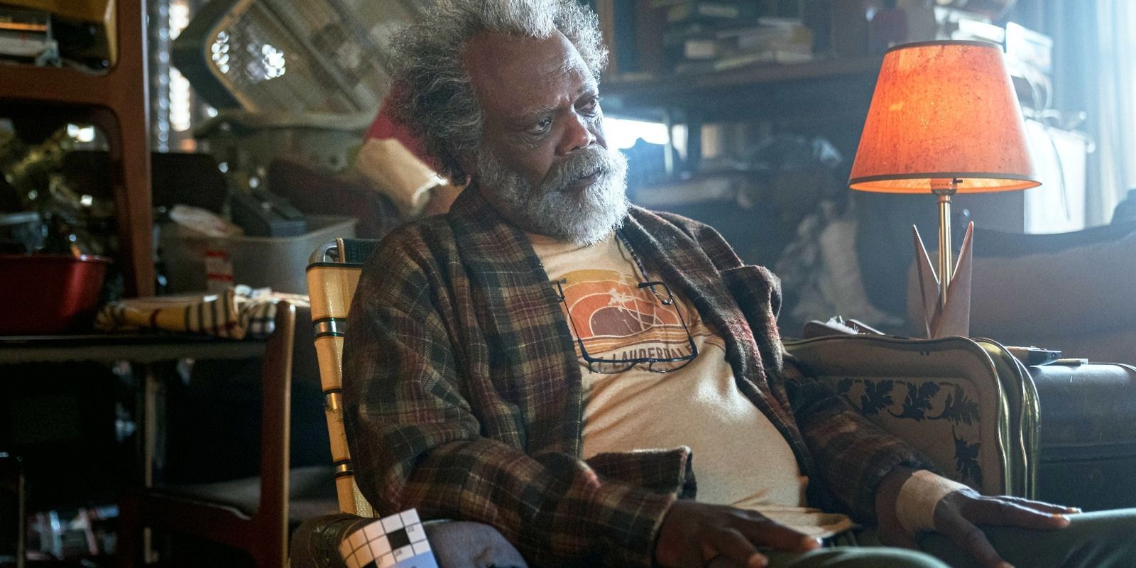 Samuel L Jackson sitting in a chair in The Last Days of Ptolemy Grey