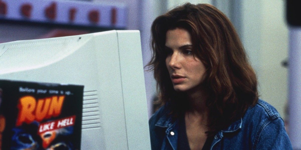 Sandra Bullock looking at a computer on The Net