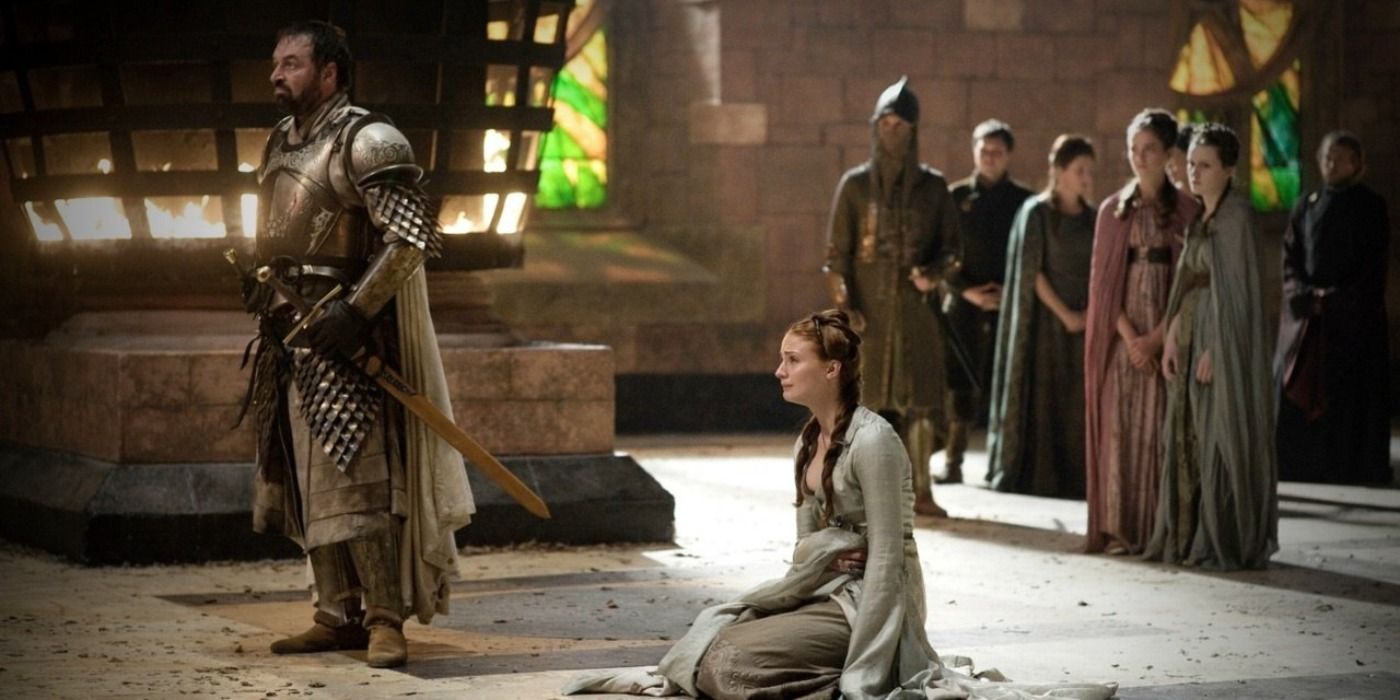 Sansa cries on her knees next to Ser Meryn Trant in Game Of Thrones