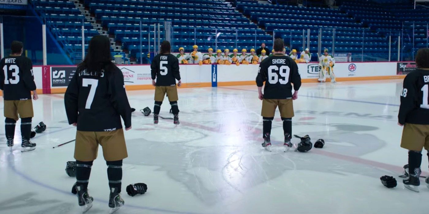 Hockey players stand around the ice in Letterkenny.