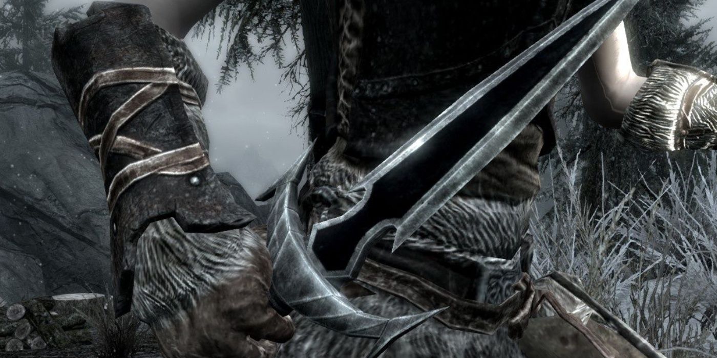 A small pointy dagger held in a gloved hand in Skyrim