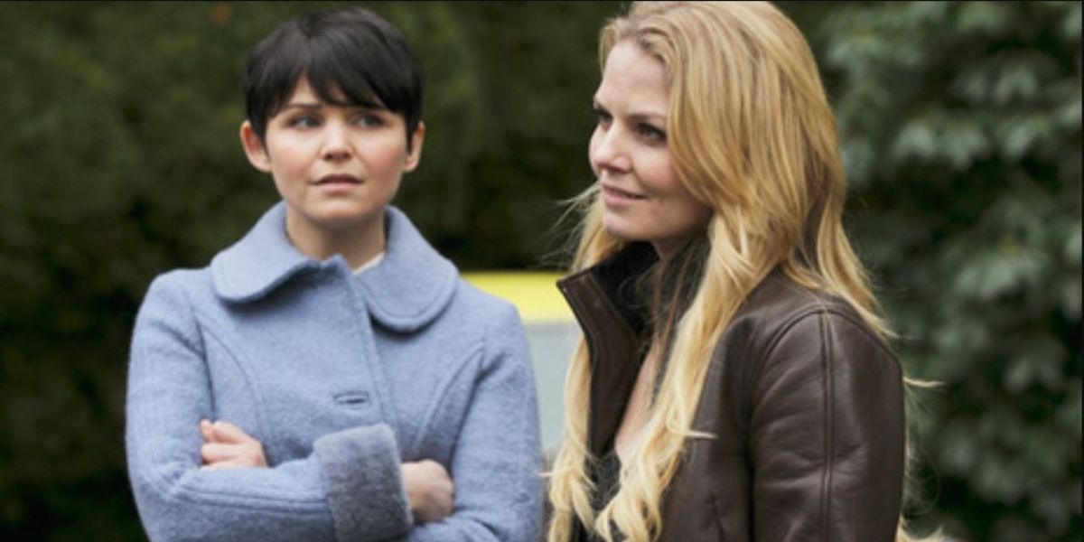 Emma and Snow standing together outdoors in Once Upon A Time