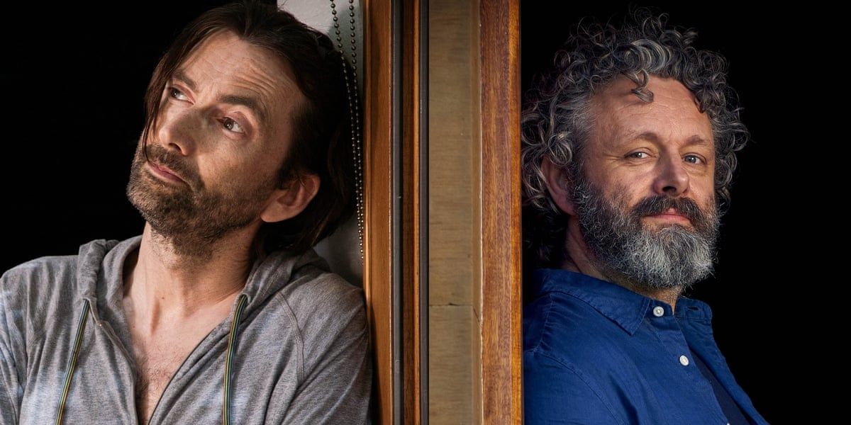 David Tennant and Michael Sheen pose on either side of a wall.