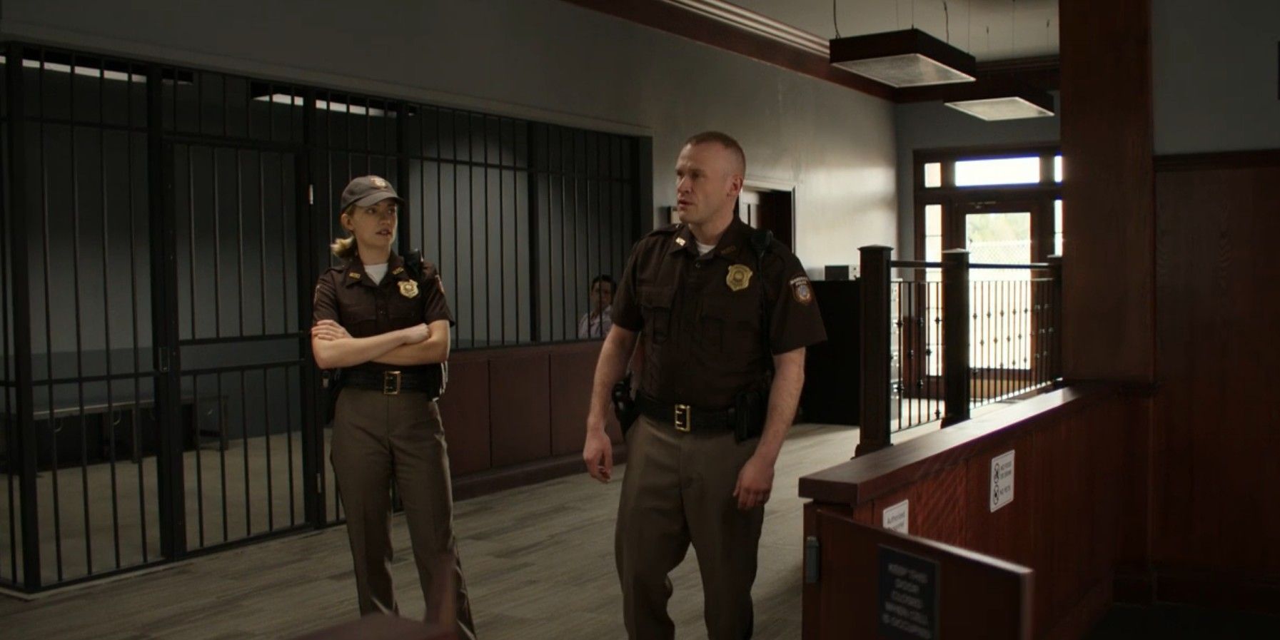 Stevenson and Roscoe stand in sheriffs department in Reacher