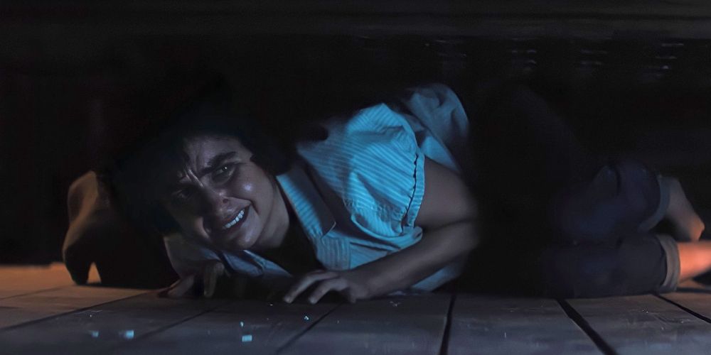 Mel hides under the bed in Texas Chainsaw Massacre 2022