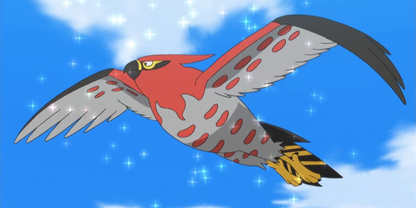 Ash's Talonflame bersinar saat terbang di udara di anime Pokemon.