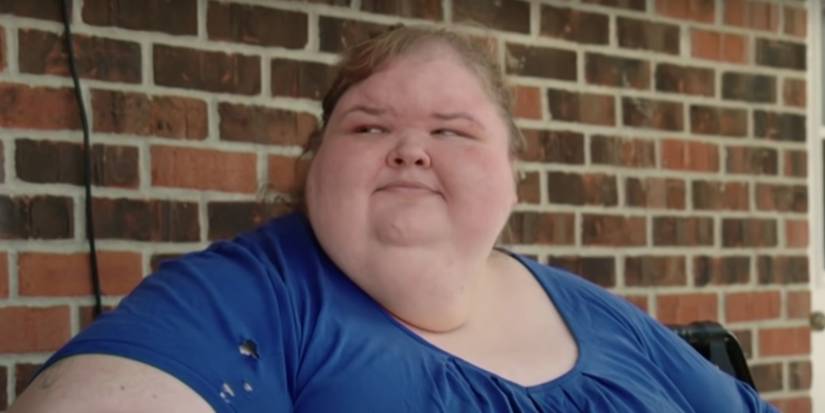 Tammy Slaton in 1000-lb Sisters in blue dress smiling faintly