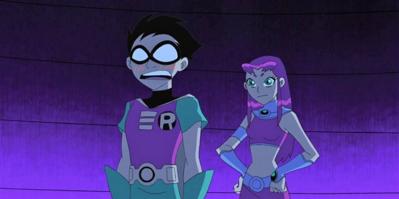 Robin looking nervous while Starfire stands behind him in Teen Titans