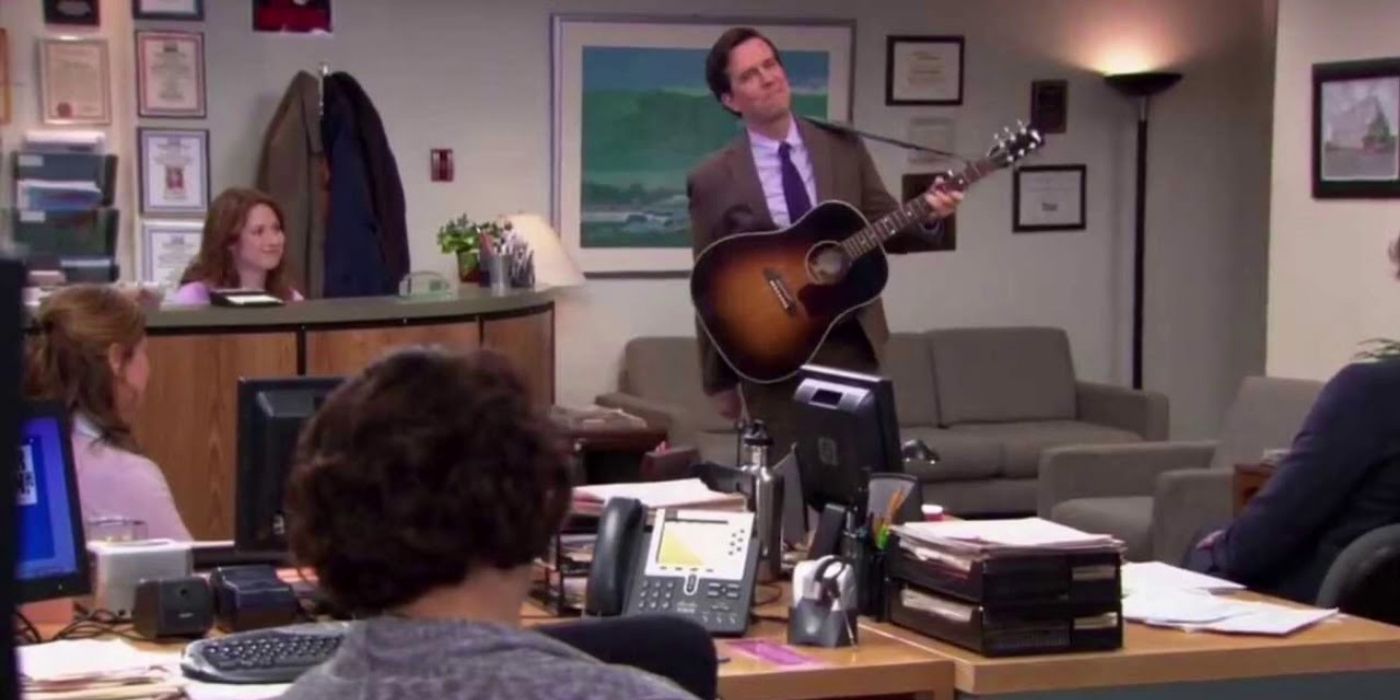 Andy playing guitar in The Office