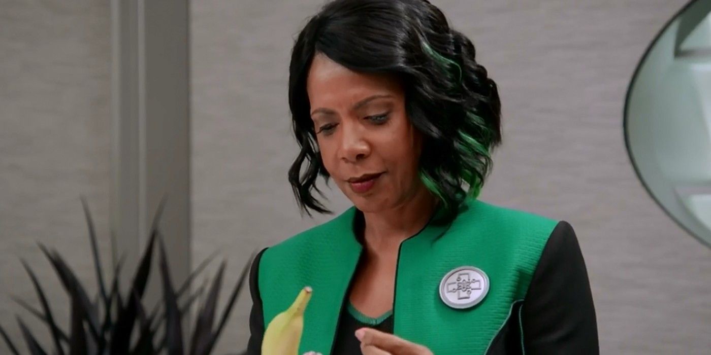Dr. Claire Finn peals a banana in The Orville.