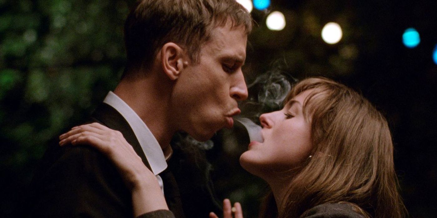 A man blows smoke into a woman&rsquo;s mouth in The Worst Person in the World