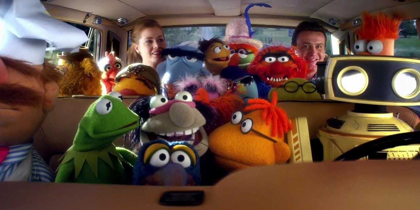 The cast of The Muppets packed in a car with Amy Adams and Jason Segel