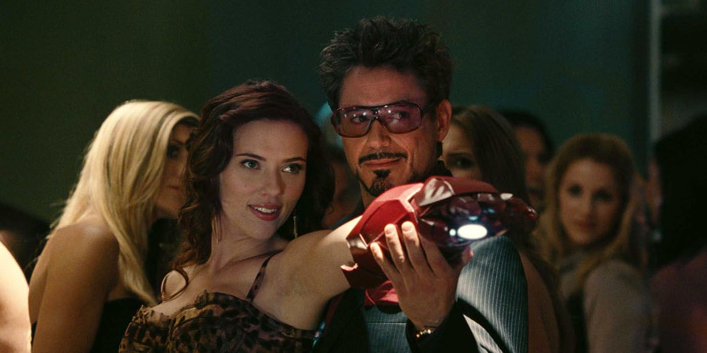 Tony Stark flirting with Natasha Romanoff.