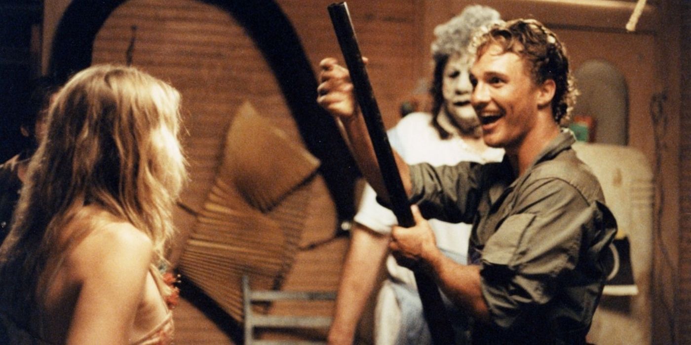 Vilmer holding a gun and smiling in Texas Chainsaw Massacre The Next Generation