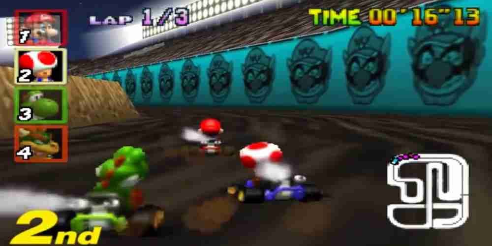 Toad is making a turn in Wario Stadium from Mario Kart 64.