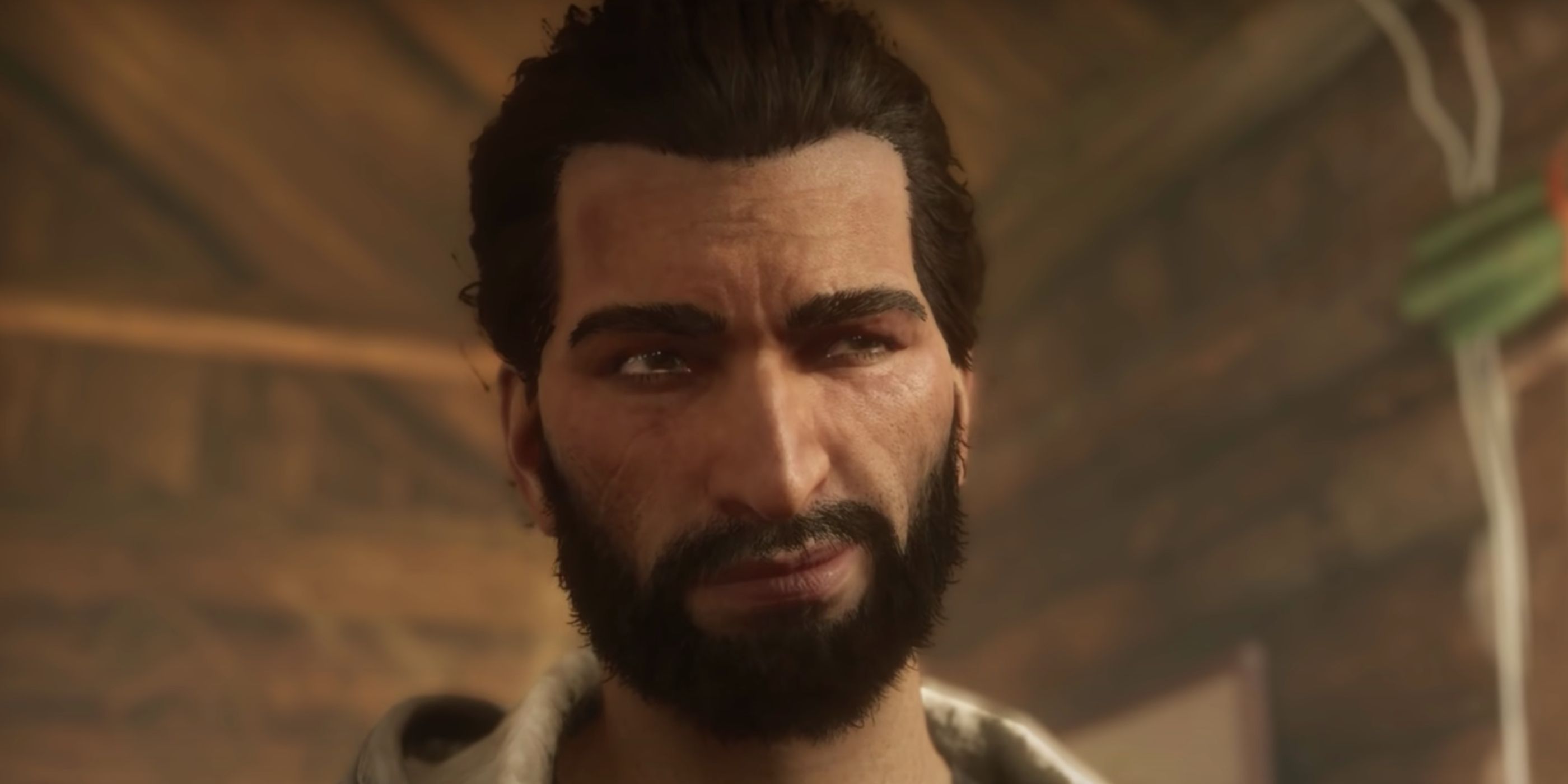Basim tersenyum ke arah kamera di Assassin's Creed Valhalla.