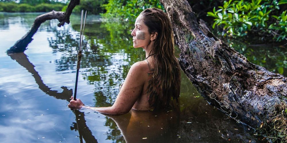 Amber wades in the water on Naked and Afraid