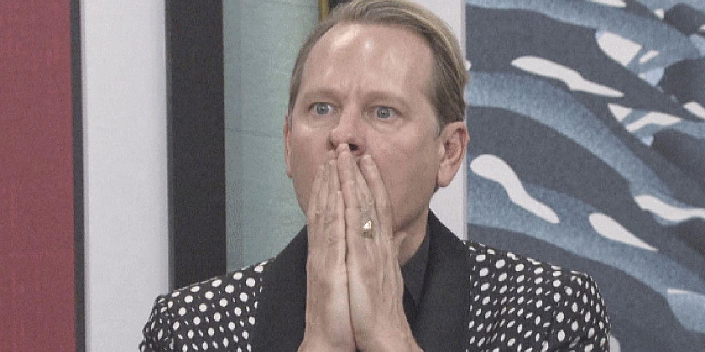 Carson Kressley with his hands to his mouth in shock in a scene from Celebrity Big Brother.