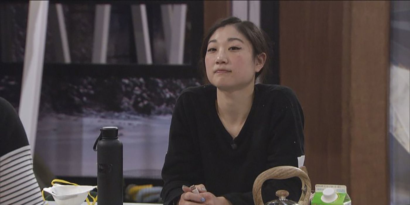 Mirai Nagasu leaning against the kitchen counter in the Celebrity Big Brother house.