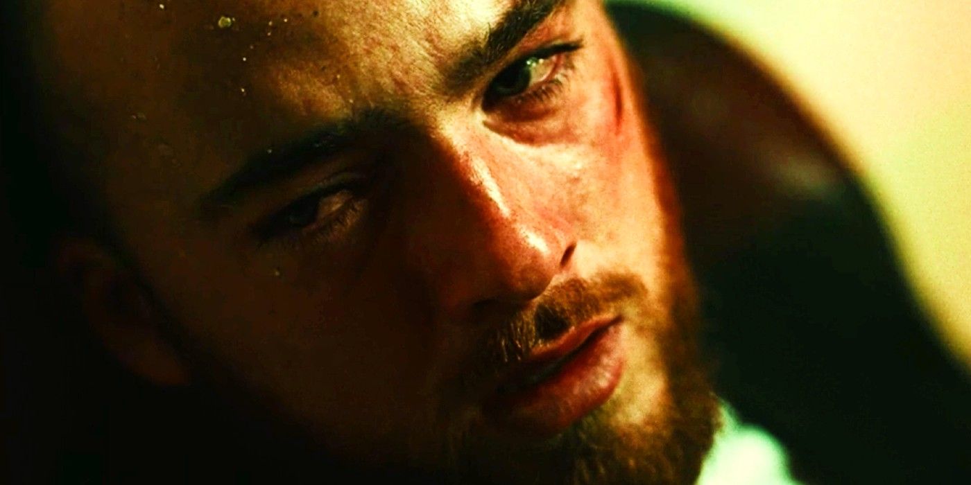 Close-up of Fez staring at Euphoria with tears in his eyes and bloody cheeks.