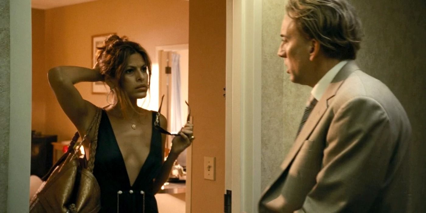 Eva Mendes opens the door to Nic Cage in Bad Lieutenant: Port Of Call New Orleans.