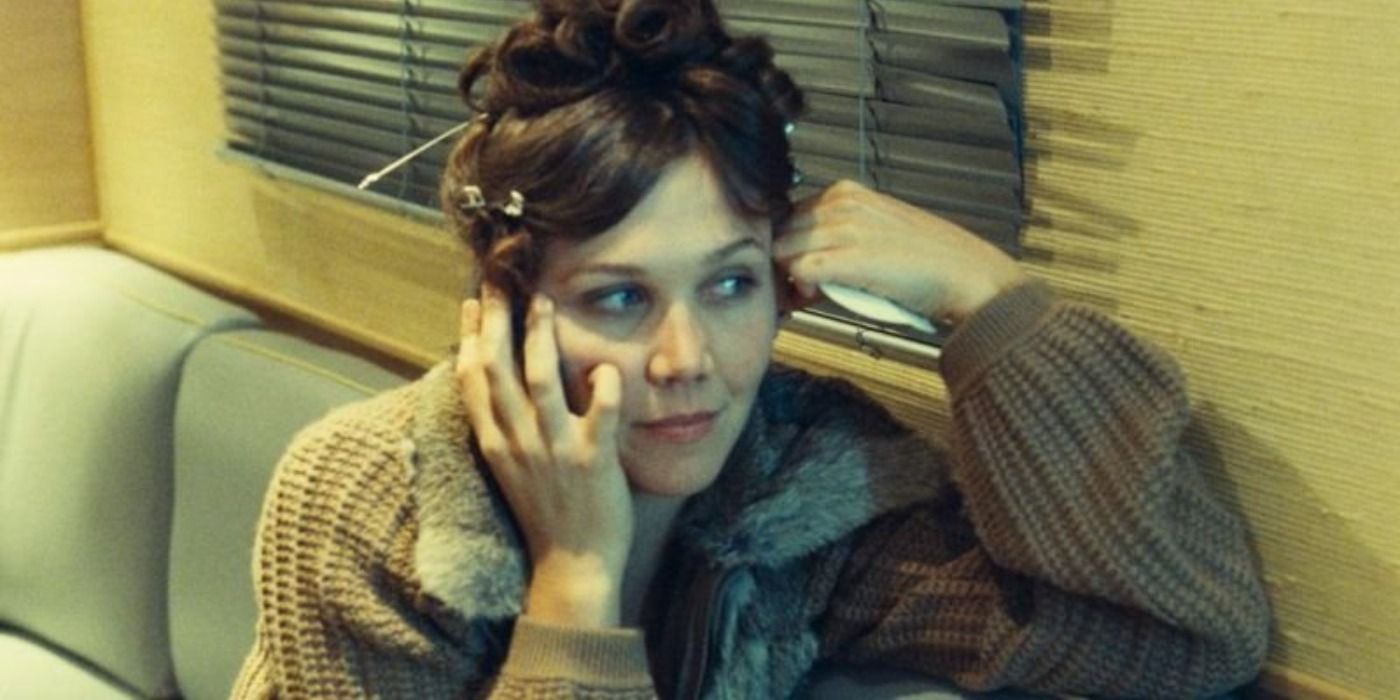 Maggie Gyllenhaal sitting on her cell phone in Paris Je T'aime.
