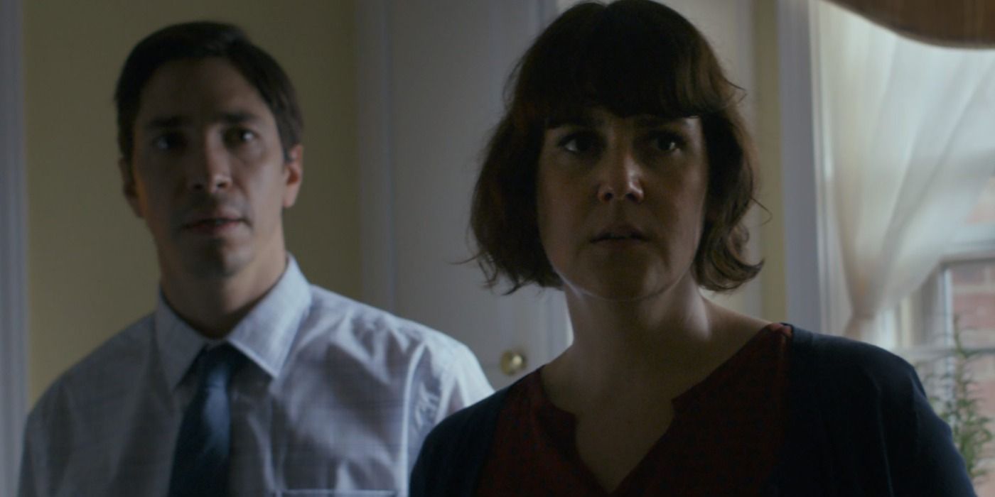 Justin Long and Melanie Lynskey looking concerned in And There I Go.