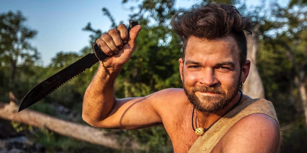 Steven Hall holds up a knife on Naked and Afraid