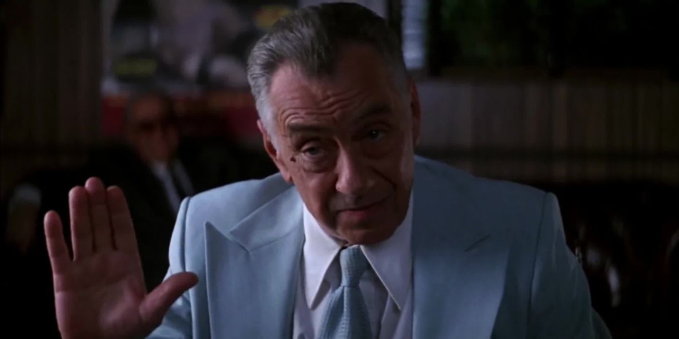 Phillip Baker Hall wearing a blue suit in Boogie Nights.