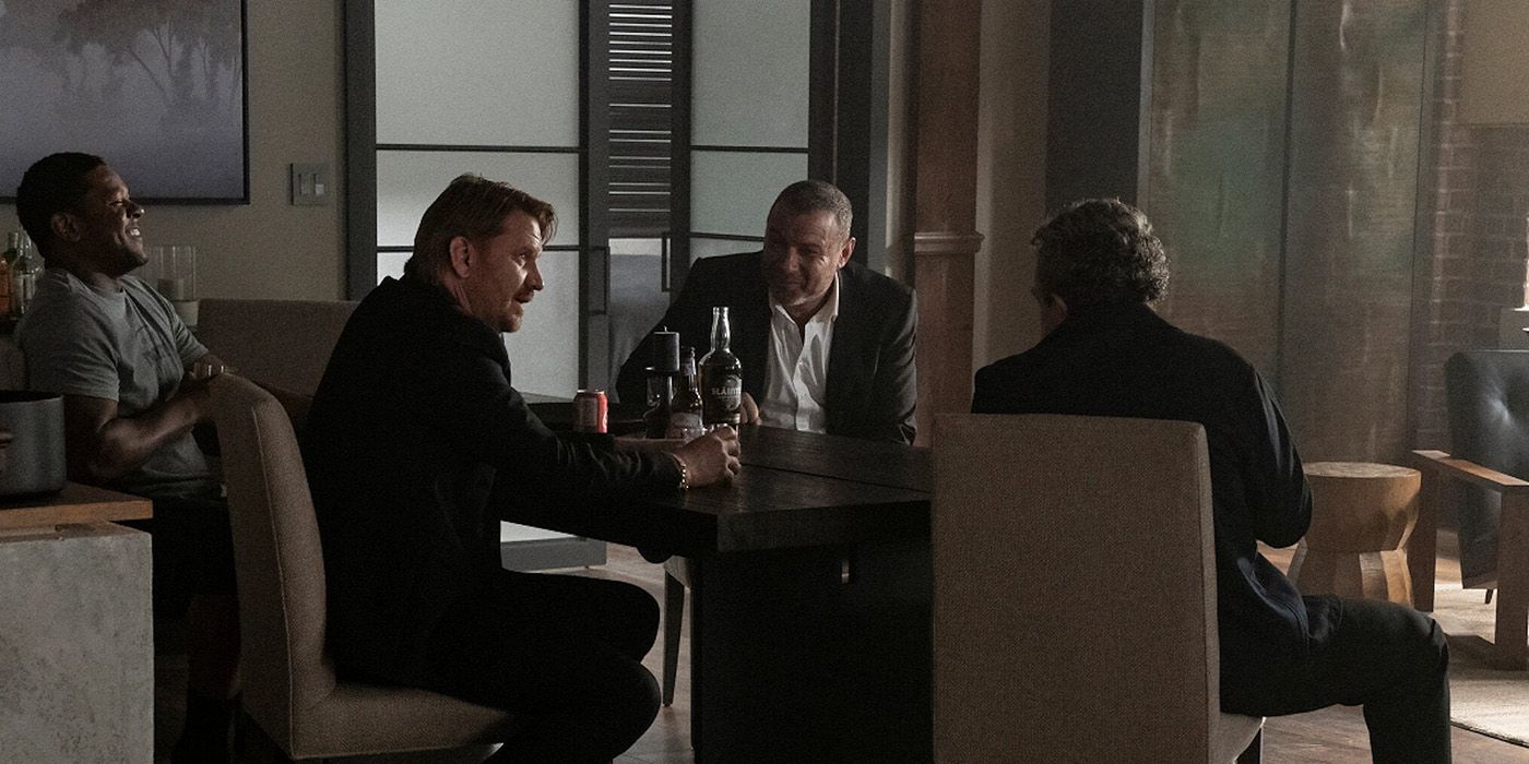 The four Donovan brothers sitting around the table drinking and smiling in Ray Donovan.