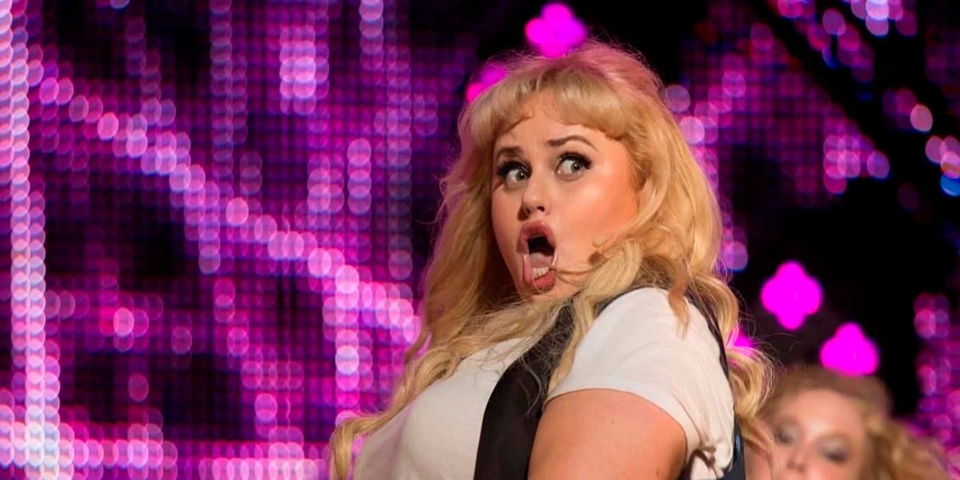 Rebel Wilson on stage singing in a scene from Pitch Perfect 2.