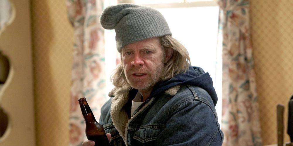 Frank holds a beer in the kitchen on Shameless