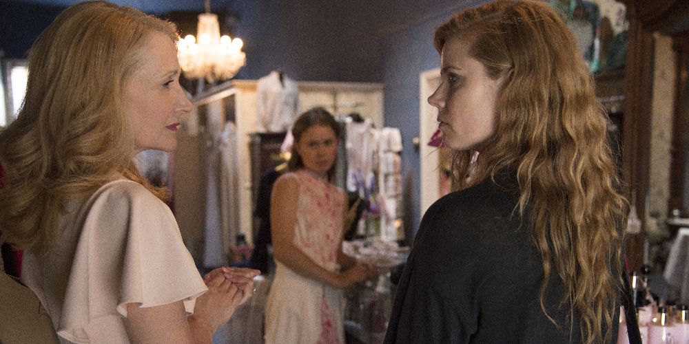 Adora and Camille face each other in profile on Sharp Objects