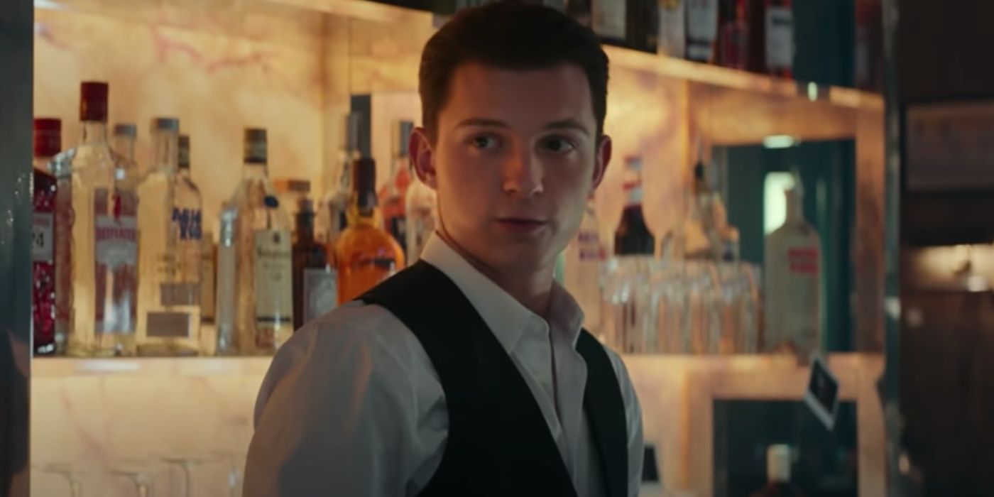 Tom Holland as Nathan Drake behind a bar in Uncharted
