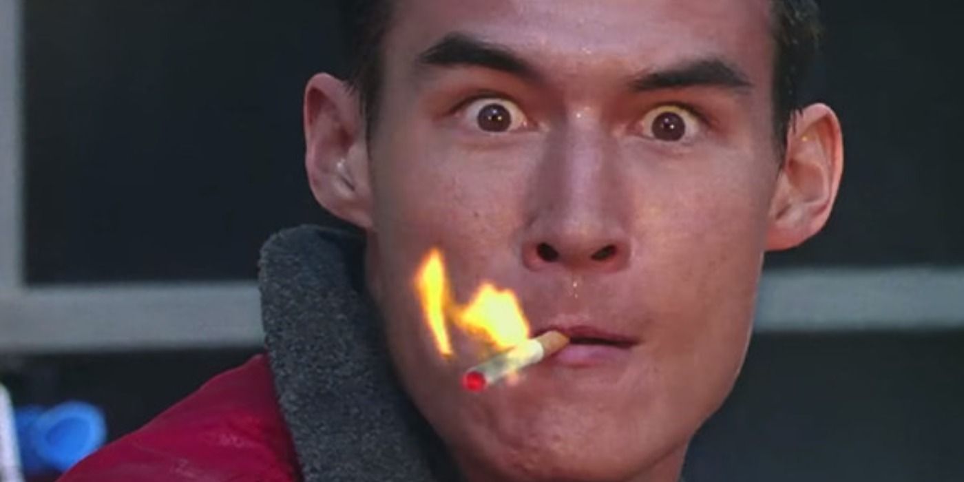 Man with lit cigarette during the gasoline fight scene in Zoolander