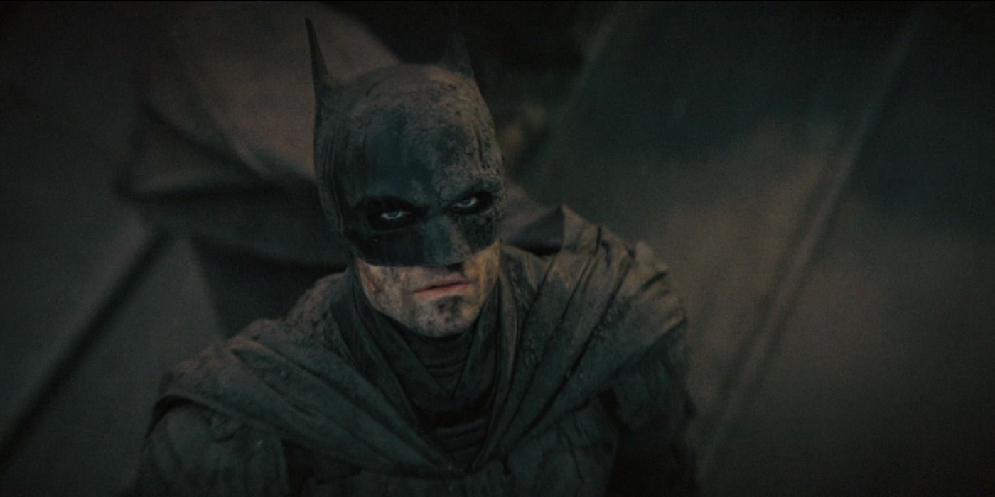 Batman helping victims of Riddler&rsquo;s attack in The Batman