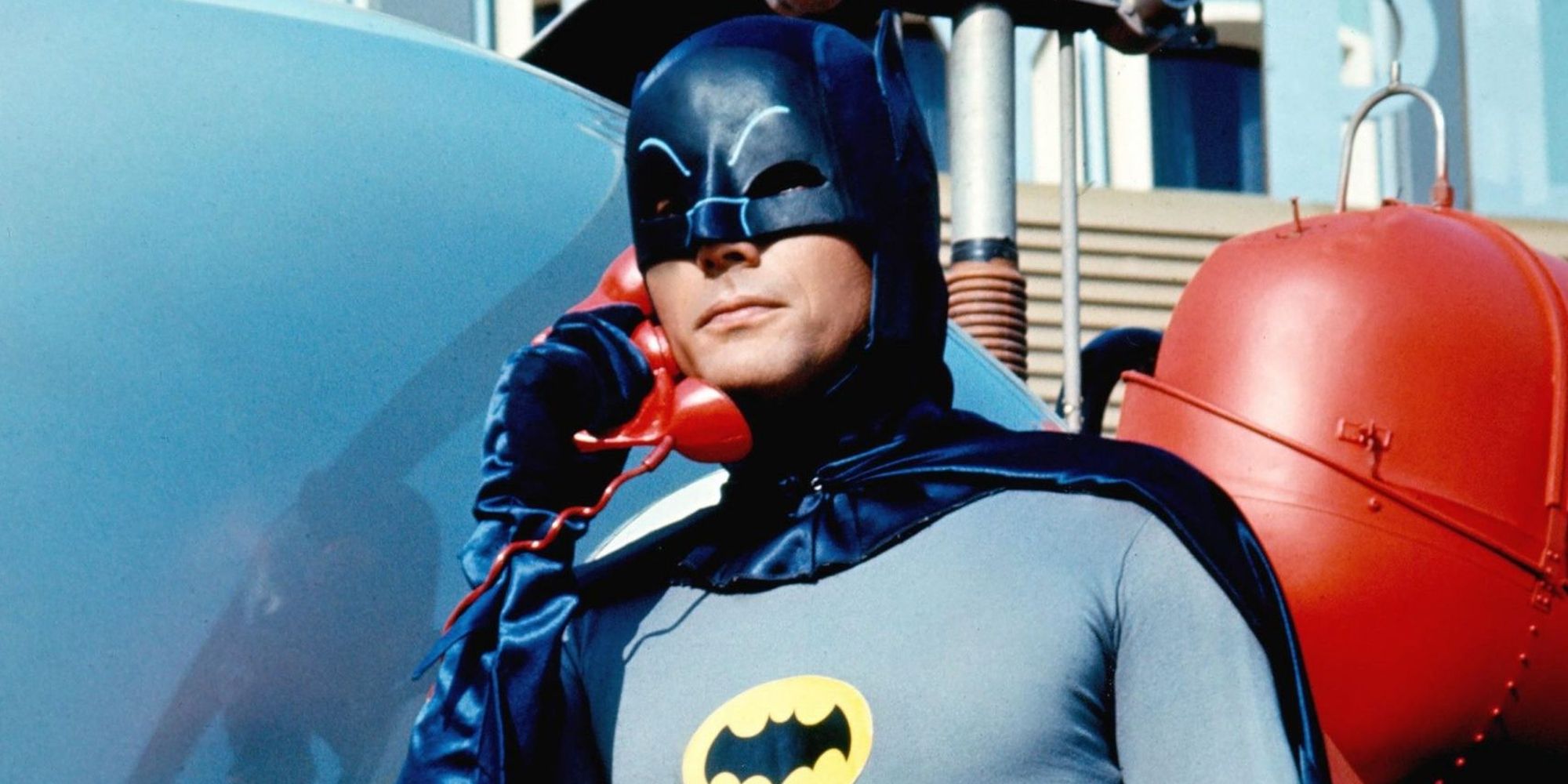 Adam West as Batman answering the red bat phone in the 166 Batman series