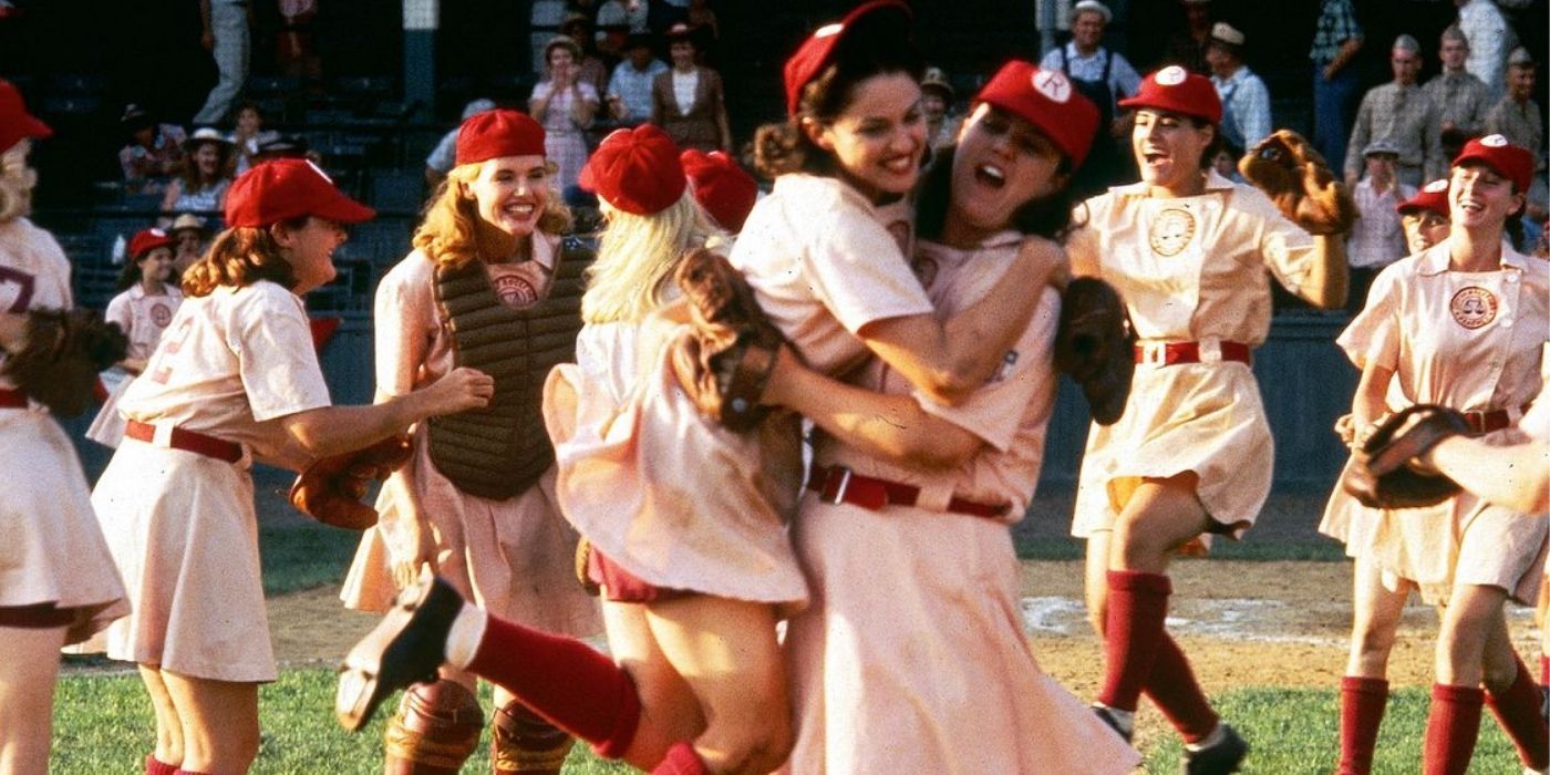 All-female baseball team celebrating together on the baseball field