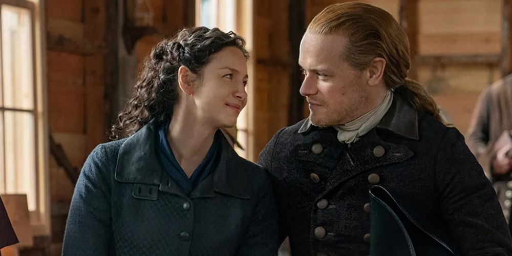 An image of Claire and Jamie smiling at one another in Outlander