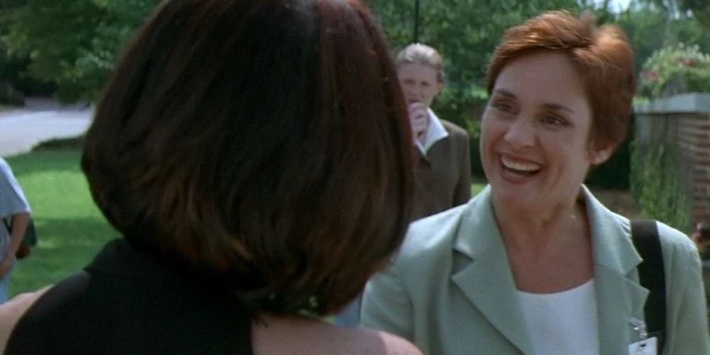 An image of Debbie Loomis smiling at Sidney in Scream