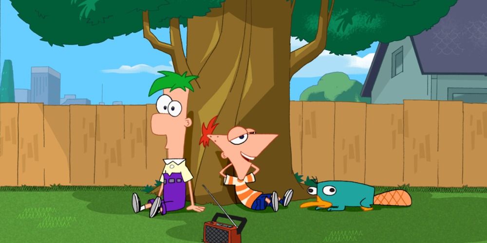 An image of Ferb and Phineas sitting under a tree with Perry