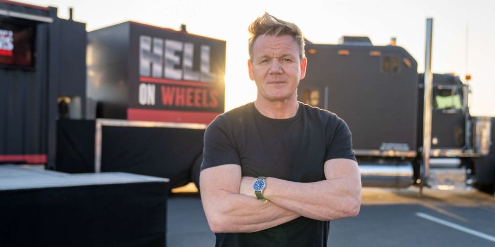 An image of Gordon Ramsay standing in front of some trucks