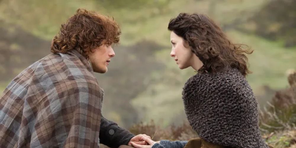 An image of Jamie and Claire talking on a cliff in Outlander
