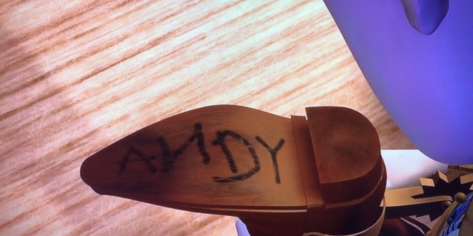 Andy's signature on the bottom of Woody's boot in Toy Story