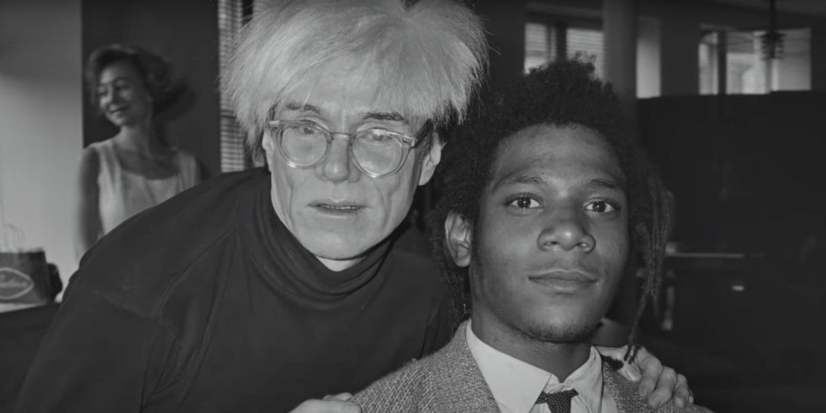 Andy Warhol and Jean-Michele Basquiat in a black and white photo