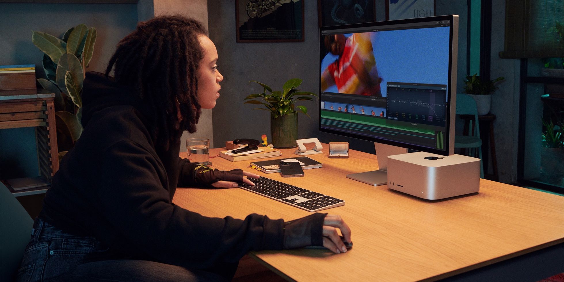 Woman using Mac Studio with Studio Display