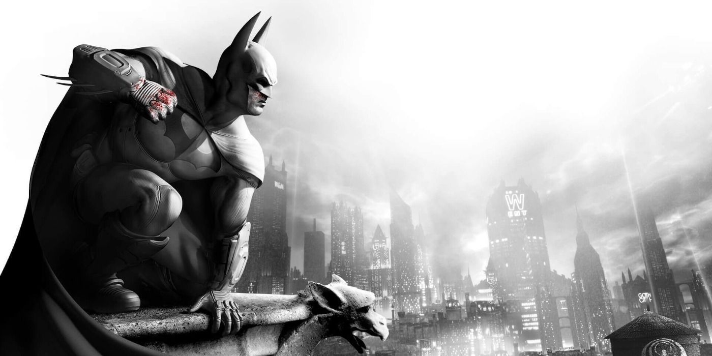 Batman perched atop a rooftop in black-and-white promo art for Arkham City.