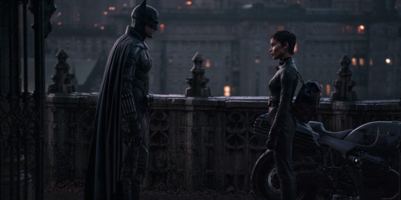 Batman and Catwoman facing each other at the end of the movie