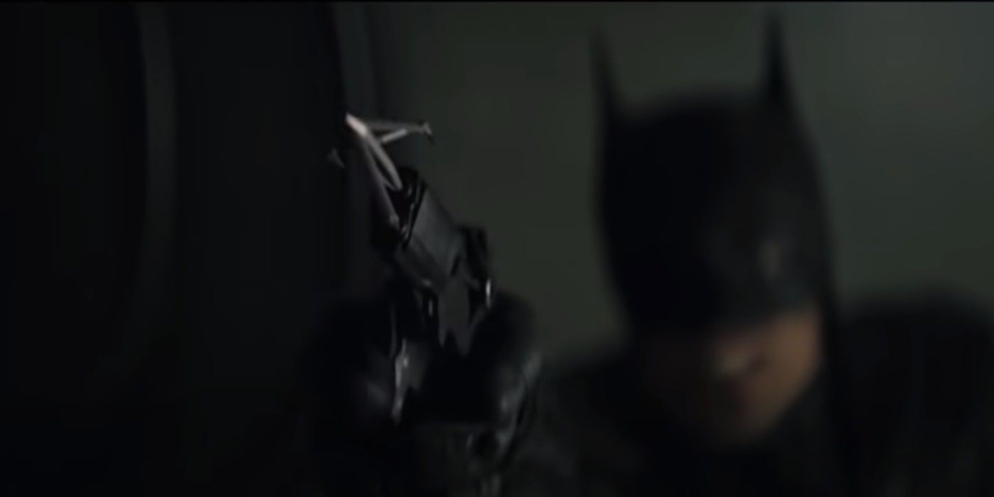 Batman shooting a concealed grapple hook gun from The Batman