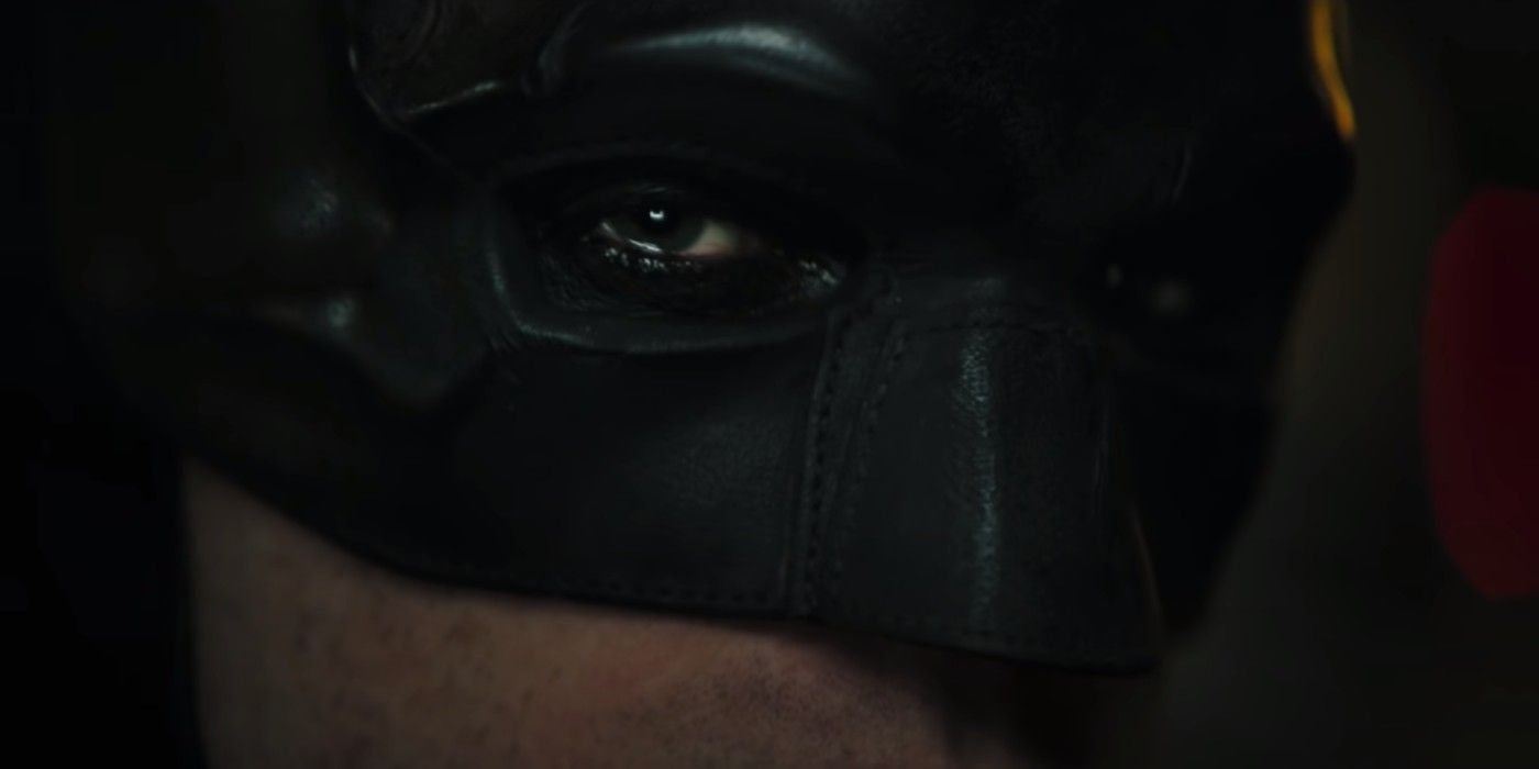 Close up of Batman's eyes, showing the exposed stitches on the cowl
